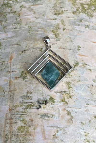 Pendant with green sodalite. Green Sodalite is a fluorescent stone